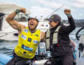 Sebastian Kördel and his coach Dom Tidey celebrate the title exuberantly at the iQFOiL World Championships in Brest.
