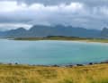 Between the rugged mountain massifs, you will repeatedly come across shallow sandy bays, such as here north of Fredvang.