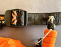 The release and leash are attached to the waist belt instead of being permanently connected. This means that the system can also be used on harnesses or other hip belts