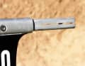 The holder for the wings is split and is pushed apart by tightening the screw