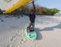 For the switch start, Wesley positions his leg on the leeward side and places his foot directly on the strap
