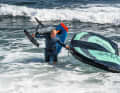 When landing, you should get off in good time and carefully push the board into shallower water. The board is then shouldered again in waist-deep water