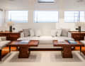 Deckhouse: Light-coloured paintwork and upholstery contrast with the mahogany fittings of the seating area, ...
