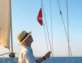 Skipper Marc Bielefeld flies the Tunisian host country flag under the saling on the way to Africa