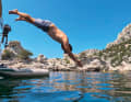 Headfirst dive into the cooling waters of the Calanque de Sugiton