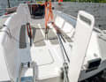 Up: The rudder blade is guided in a cassette and can be raised. Next to it are brackets for the swim ladder and outboard motor
