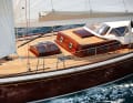 Style mix as a stylistic device. Recessed halyards, flush deck windows, portholes and skylights