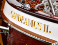 The name consists of hand-carved gold letters