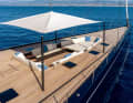 The carbon fibre tender bay on the foredeck is transformed into a relaxation zone with cushions, pillows and bimini