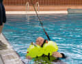 TeamO has a special harness that tows the MOB in the supine position. However, the harness is triggered manually