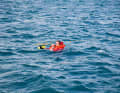 3: Circle around the person floating until they can grasp the harness. Thanks to the long floating line, the line connection is easy