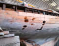 The upper planking of the hull is replaced, as are numerous components in the underwater hull