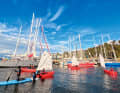The harbour of Puerto Williams. Steel blue-water yachts await Cape Horn here. And children waiting for good weather for opti-sailing
