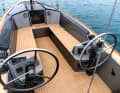 Sheer deck layout, all lines concealed right up to the helmsman. This pleases the soloists, but there is not much for the co-sailors to do