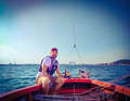 Author Sebastian Wache at the tiller and sheet on the Kiel Fjord, his home waters
