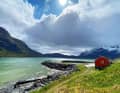 Lofoten magic: crystal-clear water stretches out at the foot of snow-capped mountains