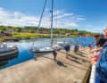 The jetty in the south-west of the large north bay. This is also where the small island ferry docks in summer. A kiosk provides those waiting with snacks and ice cream