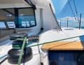 The sheets, halyards and trim lines are deflected aft. The helmsman can manage perfectly well on his own