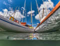 The long, narrow archipelago cruisers lie side by side in the harbour