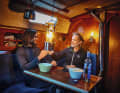 The crew enjoys cosy warmth in the saloon, even in summer it can get cool.