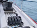 Halyards and sheets are operated by the helmsman. However, the standard winches are too small