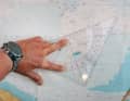 A course triangle is always aligned or read off a meridian and positioned so that the right angle of the two short sides tends to point downwards