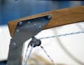 The tiller has a bend so that it also fits over the outboard motor when it is raised