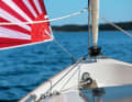 The gennaker, including the carbon fibre boom, is led through the coaming and gives the boat legs