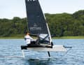 Mathis Menke on his third self-designed and built moth. The sails pulled down to the deck provide more speed. They eliminate the turbulence on the mast that was associated with the previously raised cloths