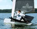 Before taking off, Moths sail in a very lopsided displacement. However, they lift themselves out of the water in winds of 6 knots or more