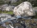 Experienced archipelago sailors tie at least one line firmly ashore. If there are no rock eyes, trees or stones are used