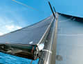 If the mast is bent, the adapter piece on the luff equalises the sail and mast