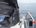 Push through the halyard: The downhaul line can now be set and the halyard pushed through. However, you can also work through the other steps first and trim the halyard at the end