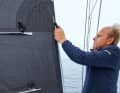 Reposition the sheet: Change the windward sheet to the upper clew and lead it through the lee haul point. Then drop it so far that the jib is covered