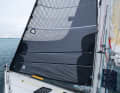 Continue with the full sail: the two long zips are clearly visible when fully set. The lower zip on the leeward side is coupled with the upper zip on the windward side to secure the cloth when reefing