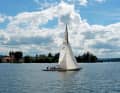 A 30-metre skerry cruiser passes the church of St. Peter and Paul in Niederzell on the north-western tip of Reichenau
