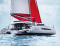The steering position is raised to the side. Steps lead up to the flybridge lounge on the upper deck