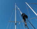 Steady the forestay: With the genoa lowered, the genoa halyard and forestay can collide in the wind. This is loud and can be solved easily: Wrap the halyard around the stay and fasten it