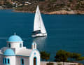 Typical Dodecanese: a white and blue chapel. We sail past it to the next harbour.