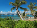Anchorage off a palm beach: this is what an escape from the European winter should be like