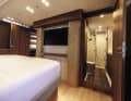 The skilfully slotted solid wood panels can also be found aft.