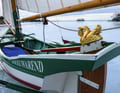 Stylish carvings adorn the replica of a traditional Ijsschuite