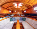 Unusual: the saloon ends in front of the mast with a bulkhead. The bow berths are accessible via an entrance in the foredeck.