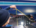 ... centre the rod in the hull and measure the distance between the ends and the leading edge of the keel and the deck. If anything is crooked, rework the holes.