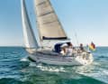 You can see her age. Tapered stepped stern, one wheel and a genoa. The Cruiser 37 was built in 2006.