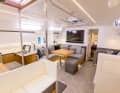 The new saloon: some fixtures have been removed, others have been remodelled and many surfaces have been wrapped in foil. The fabric upholstery is now grey and there is plenty of LED lighting.