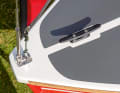 Just like the big ones: Rubbing strake, deck covering and a cleat for mooring.
