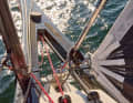 As the genoa halyard is fixed with a lock, the luff is trimmed with the mobile tack.