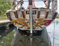 The stern of the "Störtebeker" is adorned with a skilfully crafted coat of arms. It bears witness to the proud history of this traditional sailing ship.