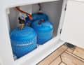 The regulator and the remote switch solenoid valve are located in the gas box. The orange sticker indicates a 50 millibar system.